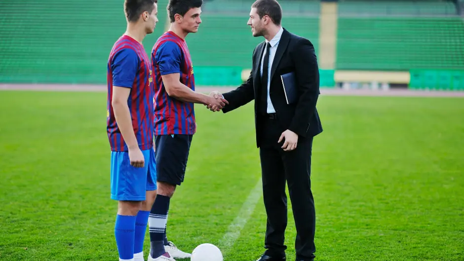 Coach leading a diverse youth sports team — institutional partnership